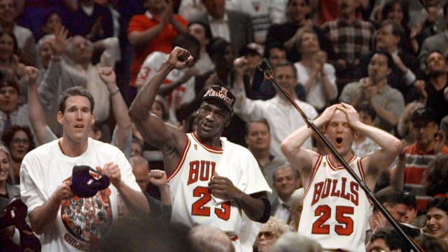 Jun 13, 1997; Chicago, IL, USA; Chicago Bulls players Judd Buechler, left, Michael Jordan, middle, and Steve Kerr celebrate after winning the NBA championship after defeating the Utah Jazz in the 1997 NBA Finals at the United Center.